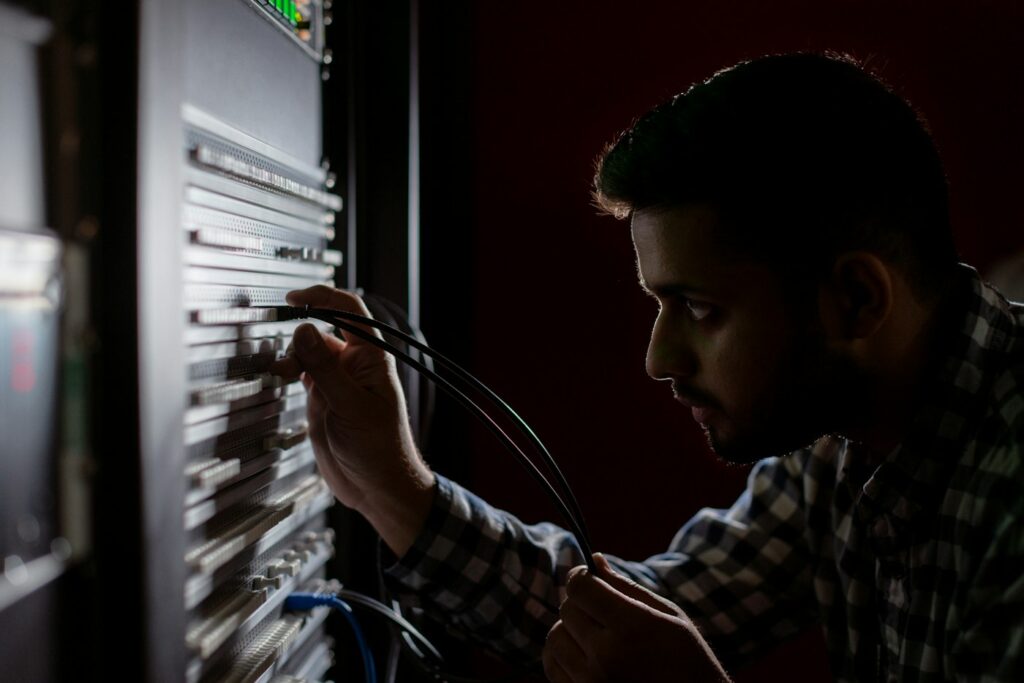 Network engineer working on a server rack