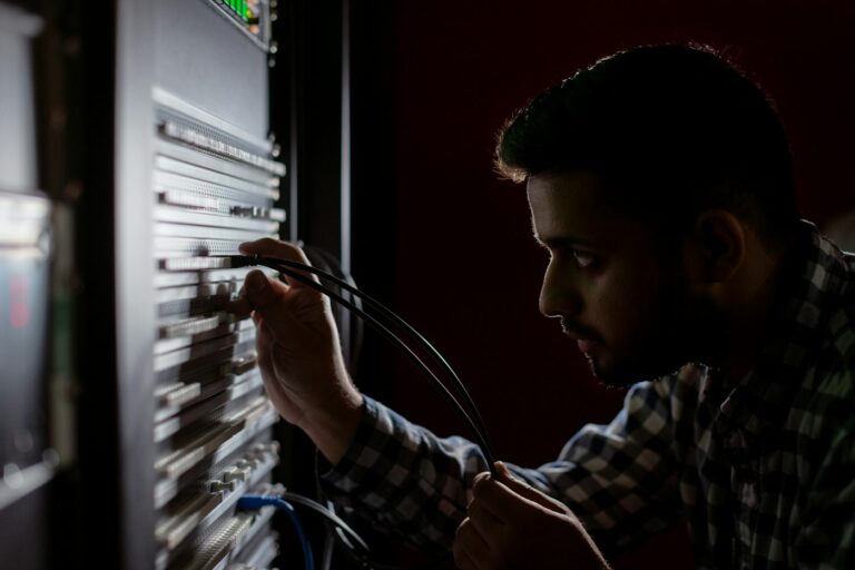 Network engineer working on a server rack